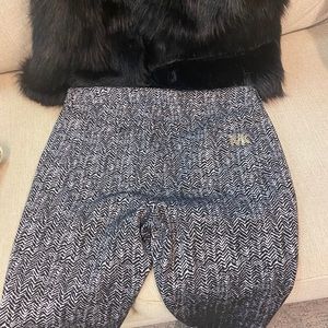 Designer pants and faux furry vest